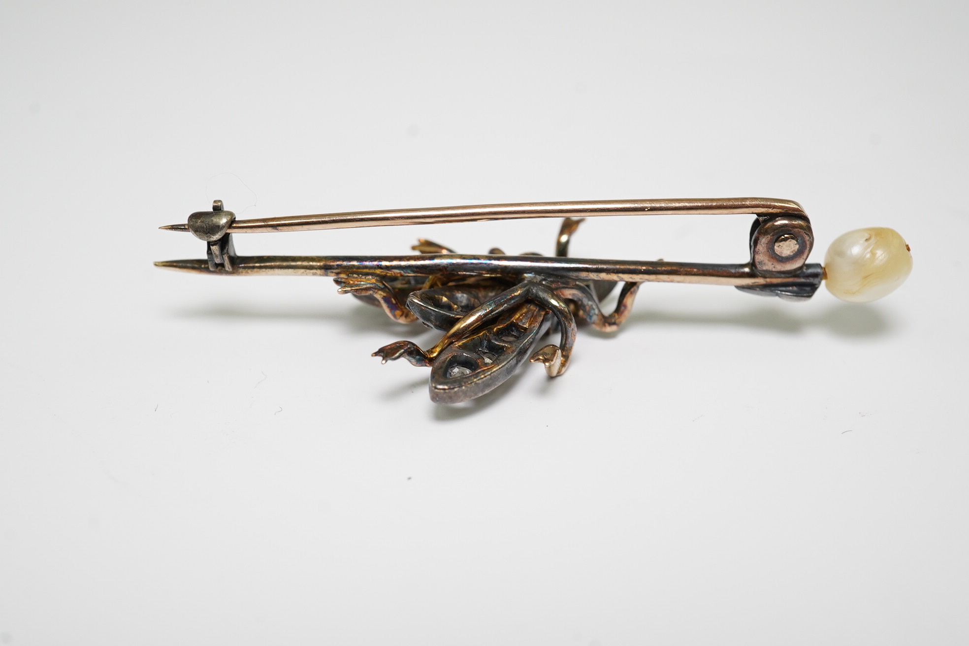 A Victorian gold and silver, pearl, rose and old cut diamond set 'bug' bar brooch